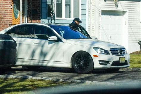 NYCHA defendant Alex Tolozano jumps into Mercedes to dodge。